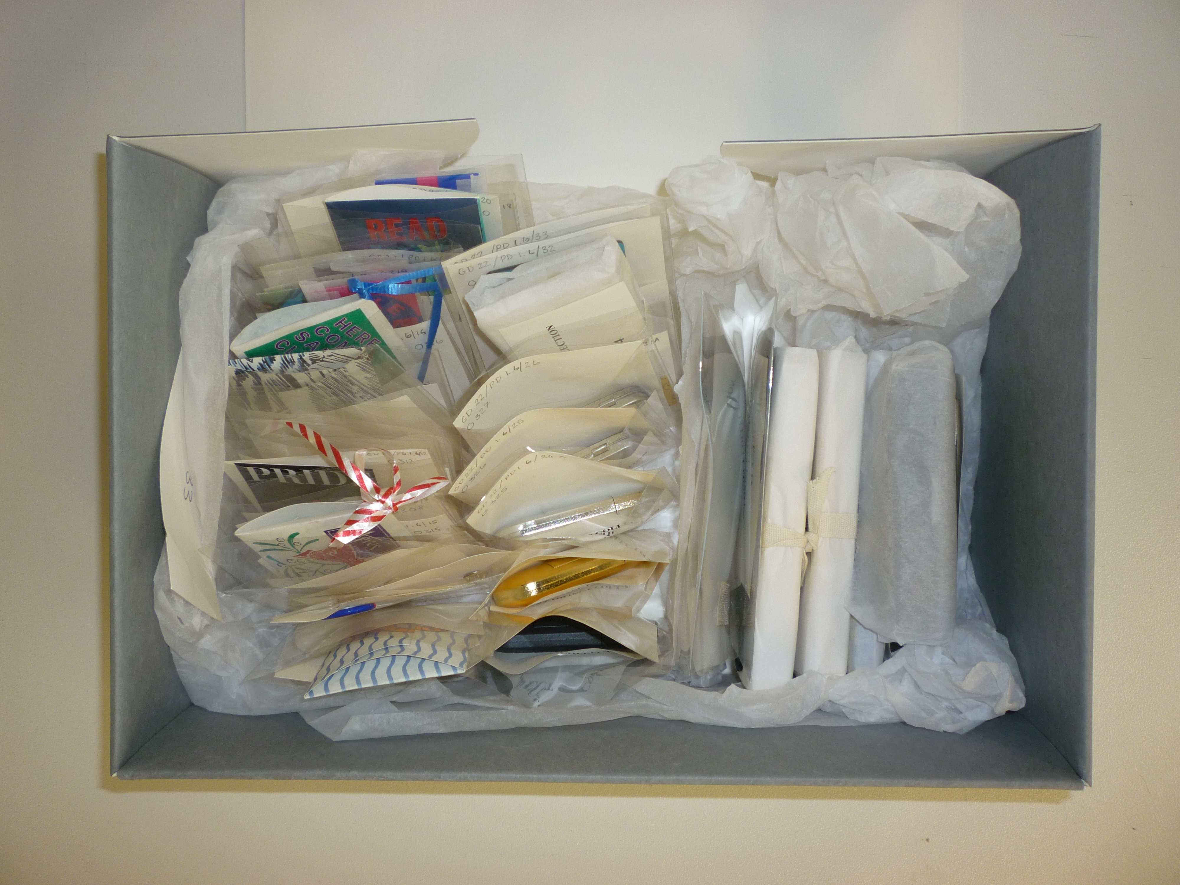 Box of plastic objects before treatment