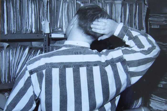 Man looking at records